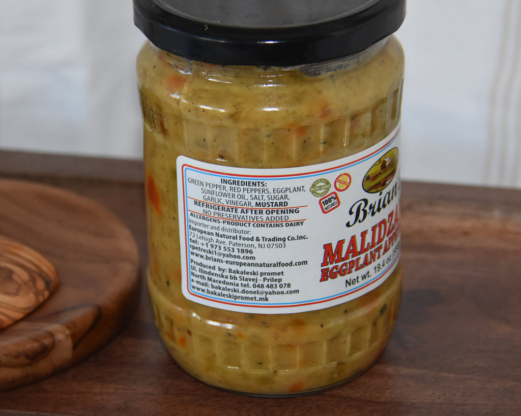 Jar of pickles with a label on a wooden surface