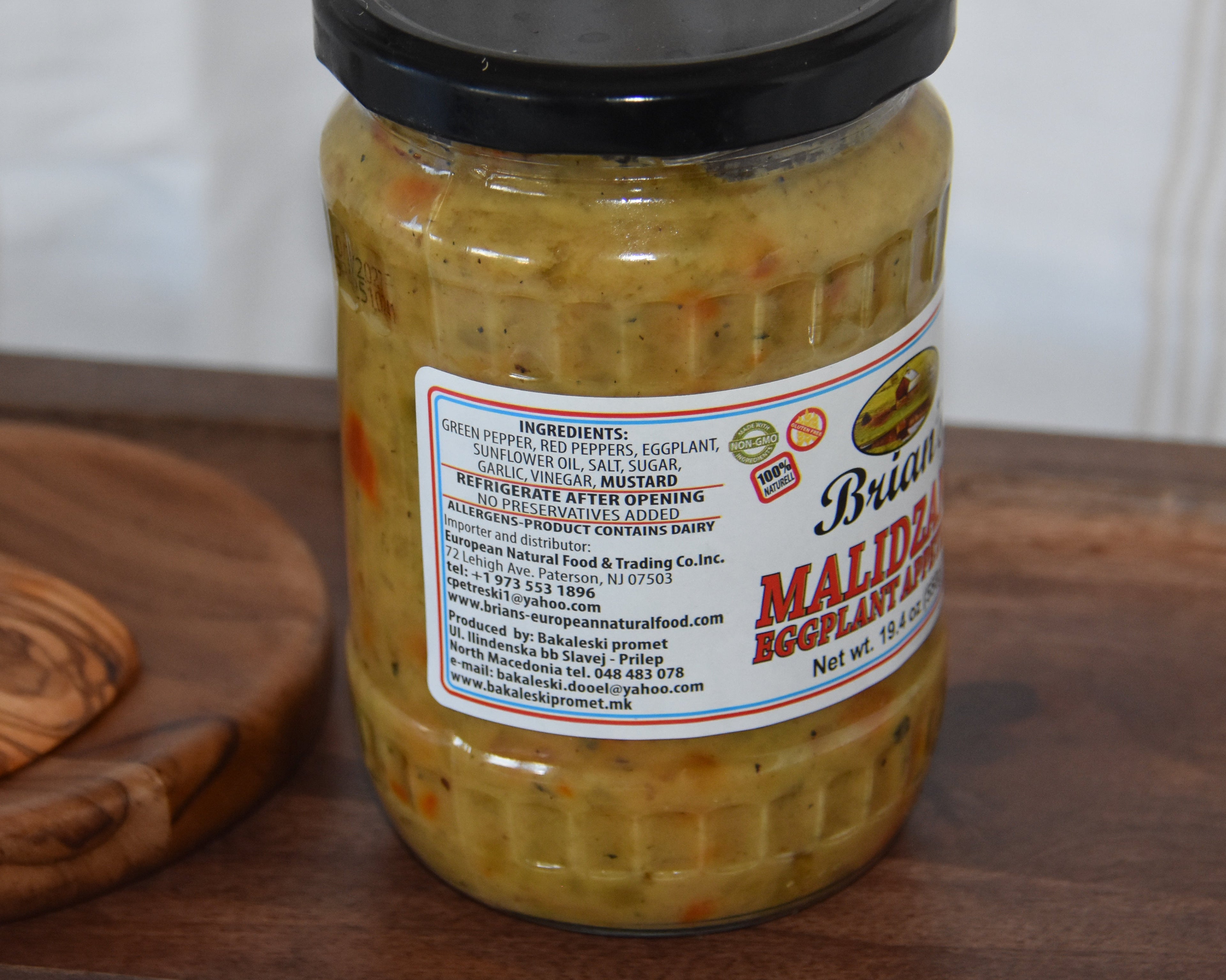 Jar of pickles with a label on a wooden surface