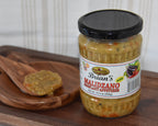 Jar of Brian's Maldzano product on a wooden tray with a wooden spoon.